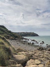 Scenic view of beach against sky