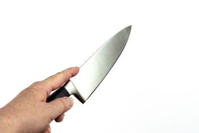 Close-up of hand holding crane against white background