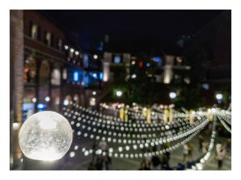 High angle view of illuminated street lights at night