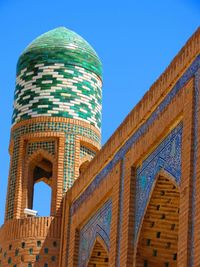 Low angle view of building against clear blue sky