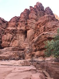 Low angle view of rock formation against sky