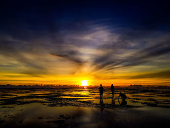 Sunset, beach and happy children.