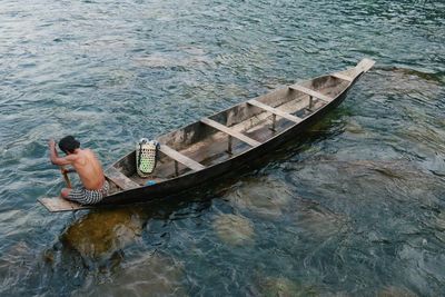 High angle view of man on boat in sea