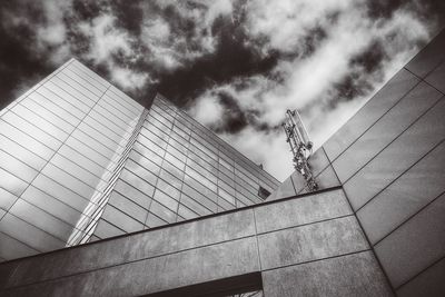 Low angle view of building against cloudy sky