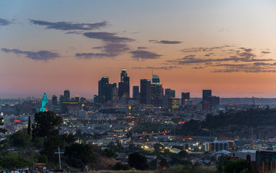 High angle view of city at sunset
