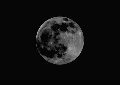 Low angle view of moon against sky at night