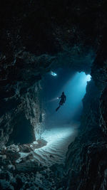 Mid adult man diving in sea