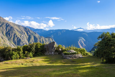 Scenic view of landscape and mountains against sky