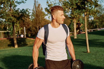Young man exercising in park