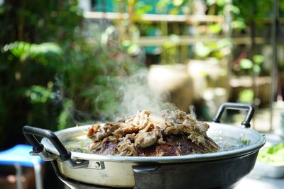 Close-up of meat in container on table