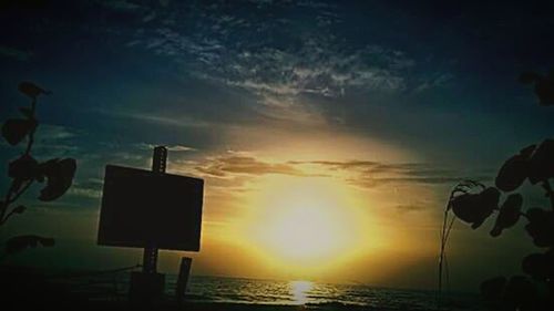 Scenic view of sea against sky at sunset