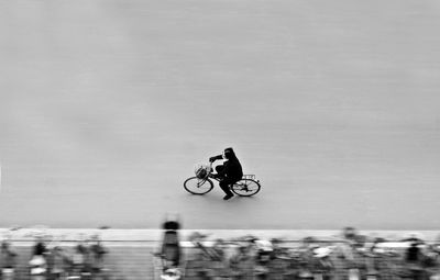 High angle view of man riding bicycle in city