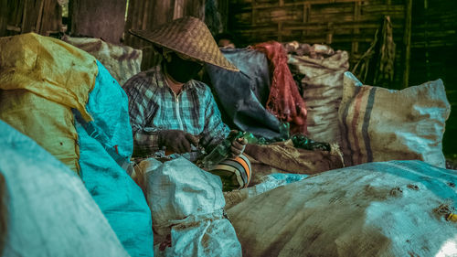 Rear view of man standing in temple