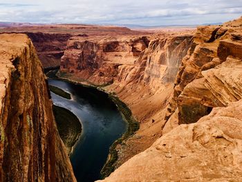 Panoramic view of river amidst rock formations against sky