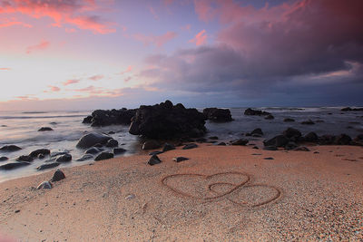 View of beach against cloudy sky