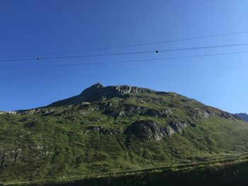 Low angle view of mountain against clear sky