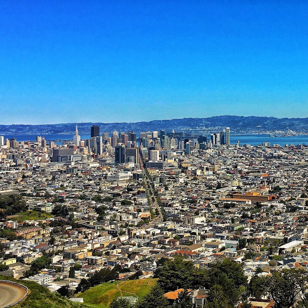 AERIAL VIEW OF CITYSCAPE AGAINST CLEAR SKY