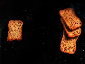 High angle view of breakfast on table against black background