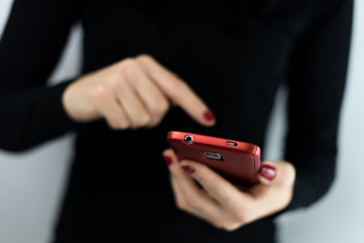 Close-up of woman using smart phone