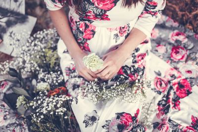 High angle view of woman holding bouquet