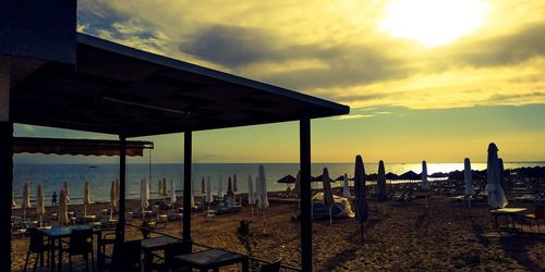 Scenic view of beach against sky during sunset
