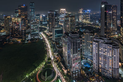 High angle view of illuminated city buildings at night