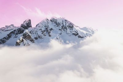 Scenic view of snowcapped mountains against sky during sunset