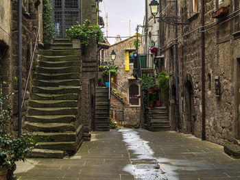 Narrow alley amidst buildings in city