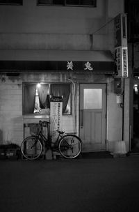 Bicycle parked by building