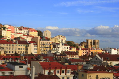 Houses in town against sky