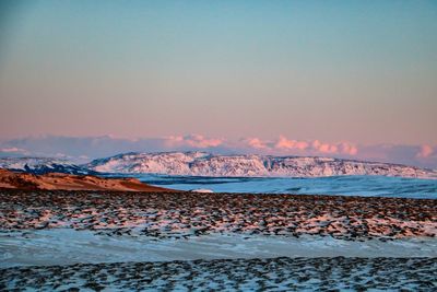 Scenic view of snow capped mountains 