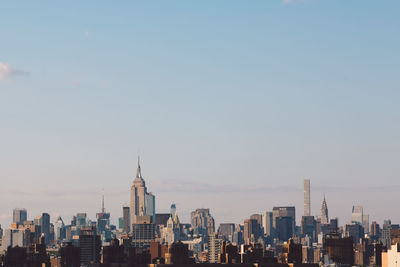 Skyscrapers in city against clear sky