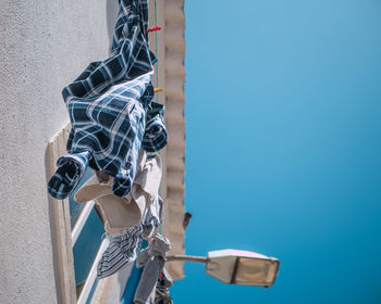 Low angle view of bicycle against clear blue sky