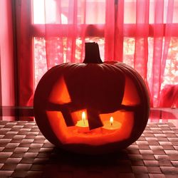 Close-up of illuminated pumpkin at home