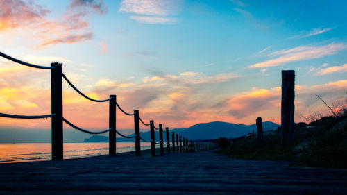 Scenic view of beach against sky during sunset