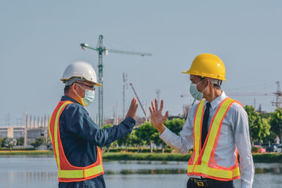 Man working with arms raised