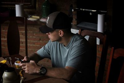 Man working on table at home