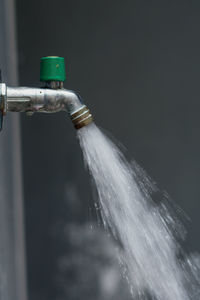 Close-up of water spraying from pipe