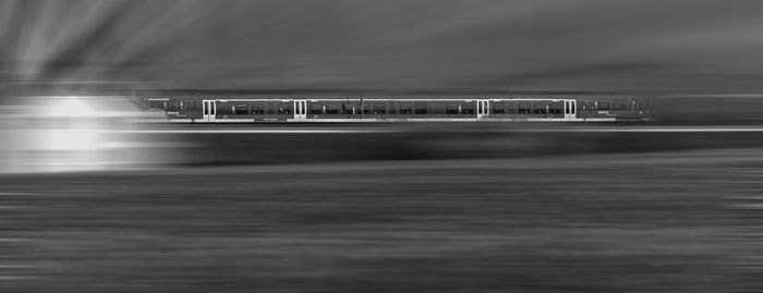 Blurred motion of boat in sea at night