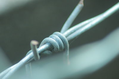 Close-up of metal fence against black background