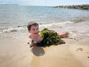 Portrait of happy boy on beach