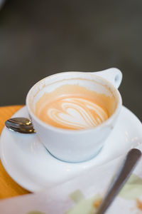 Close-up of cappuccino on table