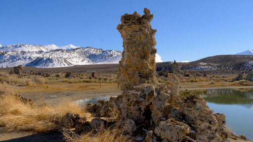 Scenic view of mountains against clear blue sky