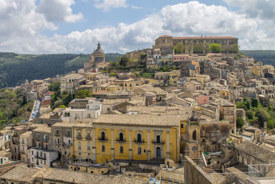 View of old town against cloudy sky, ragusa ibla