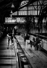 People walking in corridor of building