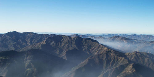 Scenic view of mountain range against clear sky