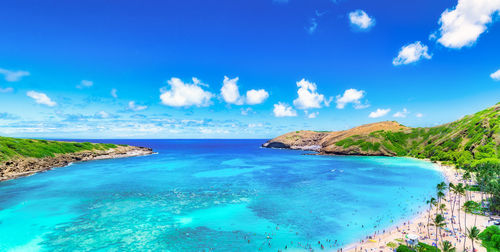 Panoramic view of sea against blue sky