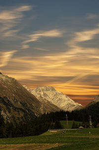 Scenic view of landscape against sky during sunset