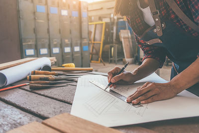 Midsection of woman working on table