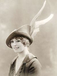 Portrait of young woman wearing hat